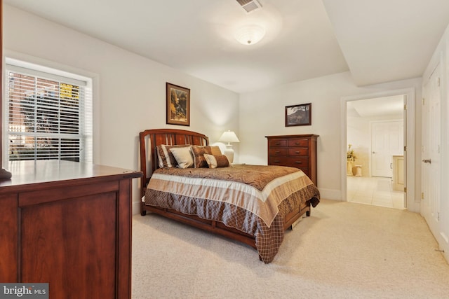 bedroom featuring light colored carpet