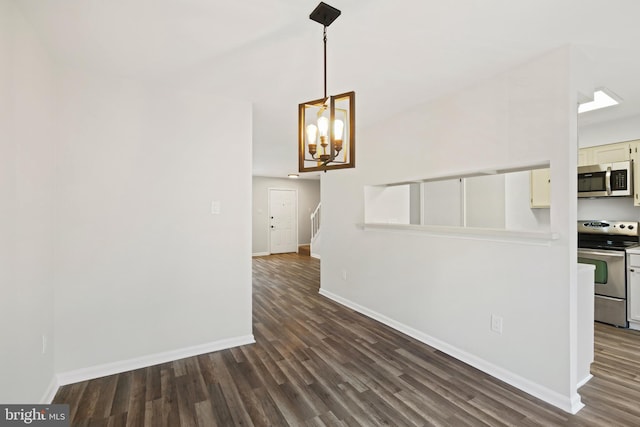 interior space with dark hardwood / wood-style flooring and a notable chandelier