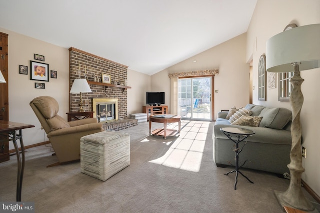 carpeted living room featuring lofted ceiling and a brick fireplace