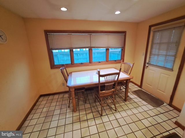 dining area featuring light tile patterned floors