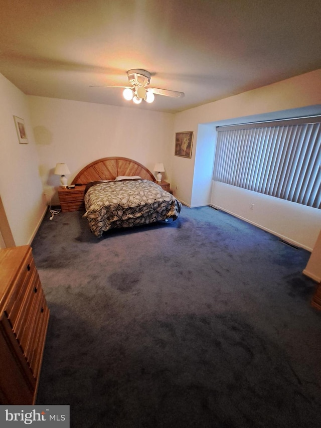 unfurnished bedroom featuring carpet floors and ceiling fan