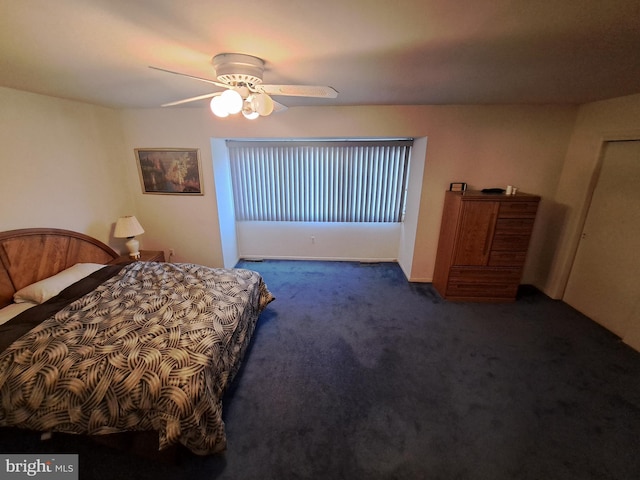 bedroom featuring dark colored carpet and ceiling fan