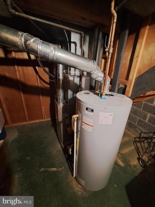 utility room featuring water heater