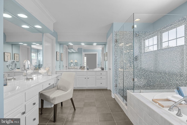 bathroom with shower with separate bathtub, ornamental molding, tile patterned floors, and vanity