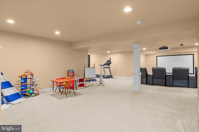 playroom featuring light colored carpet and ornate columns