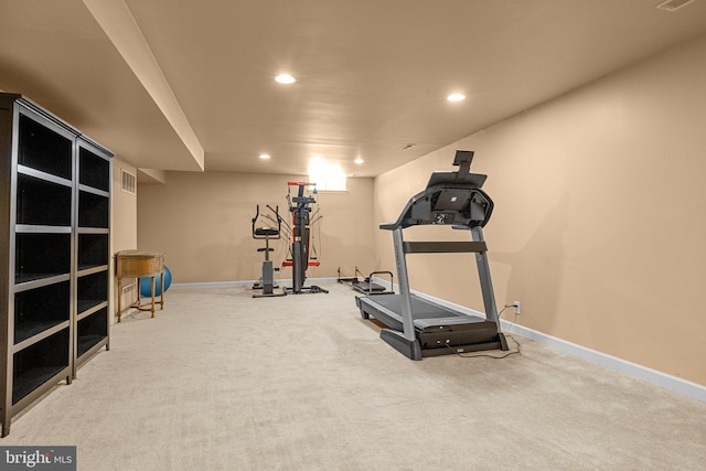 workout area featuring carpet flooring