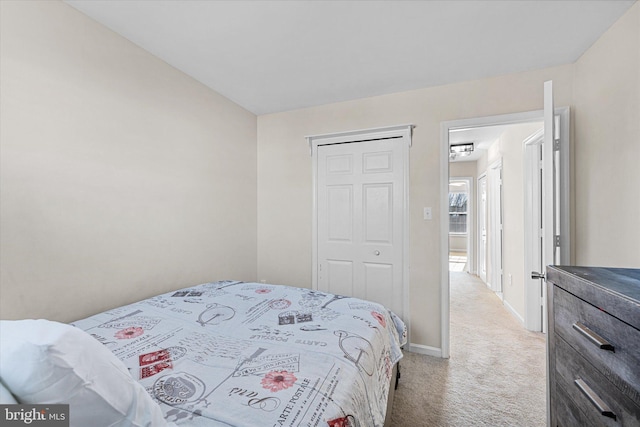 carpeted bedroom with a closet