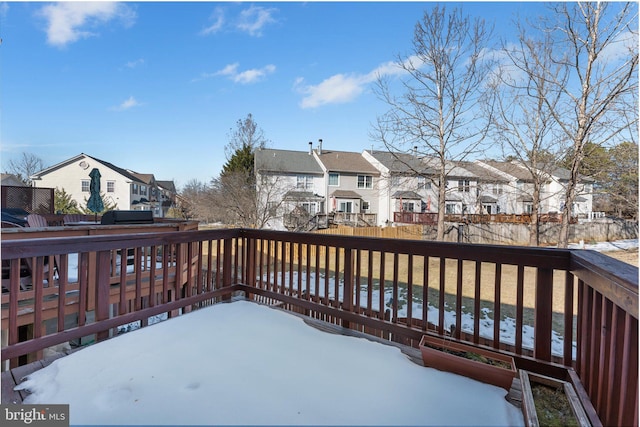 view of snow covered deck