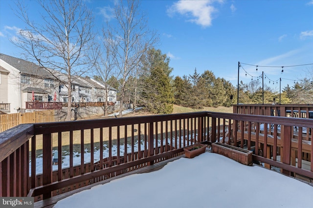 view of snow covered deck