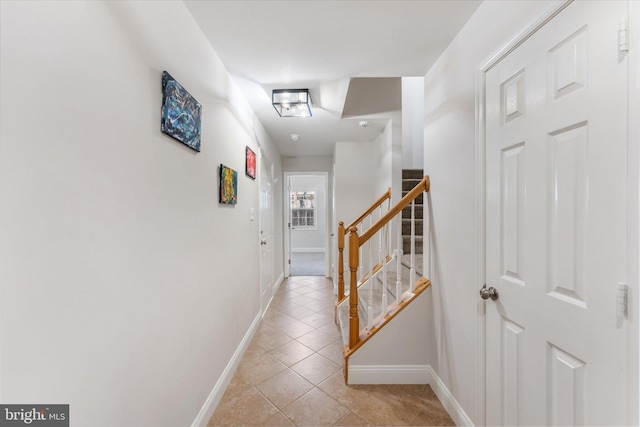 hallway with light tile patterned floors