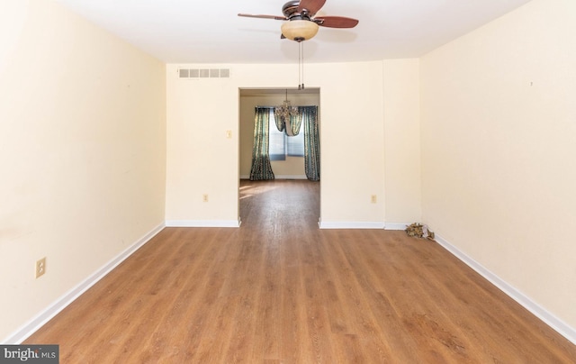 empty room featuring ceiling fan and light wood-type flooring