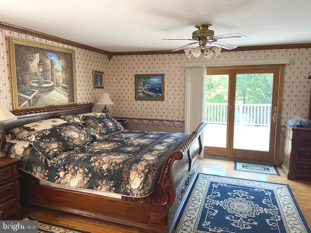 bedroom with crown molding, access to exterior, ceiling fan, and light hardwood / wood-style floors