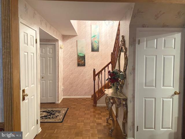 entrance foyer with parquet flooring