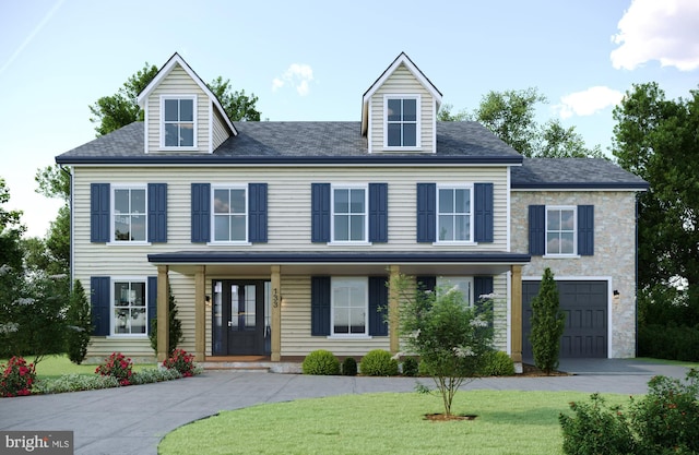 view of front facade featuring a front yard, french doors, driveway, and an attached garage