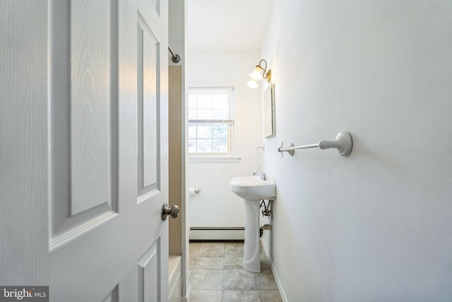 bathroom featuring a baseboard radiator and tile patterned flooring