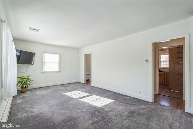 interior space featuring dark carpet