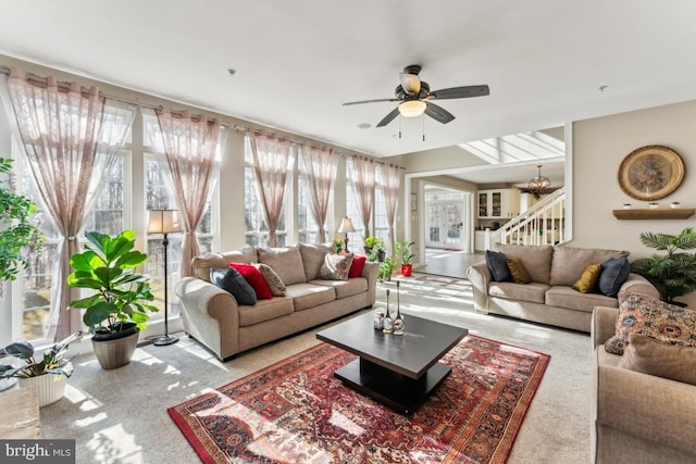 living room with plenty of natural light and ceiling fan