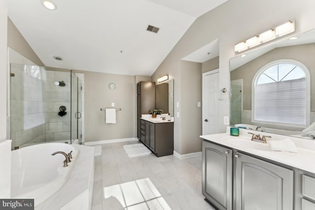 bathroom with vanity, plus walk in shower, and vaulted ceiling