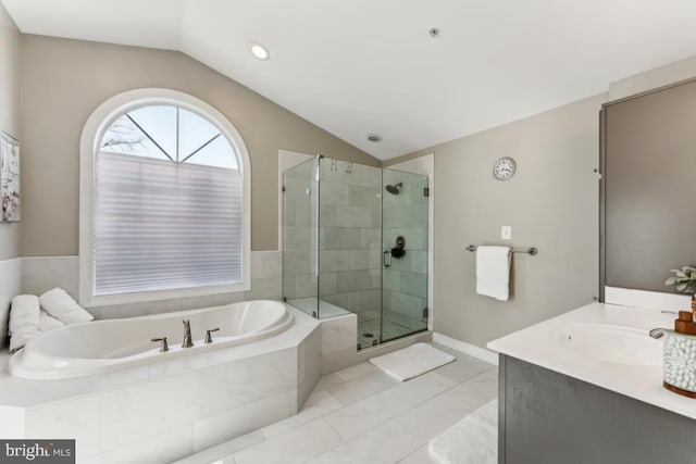 bathroom with shower with separate bathtub, lofted ceiling, and vanity