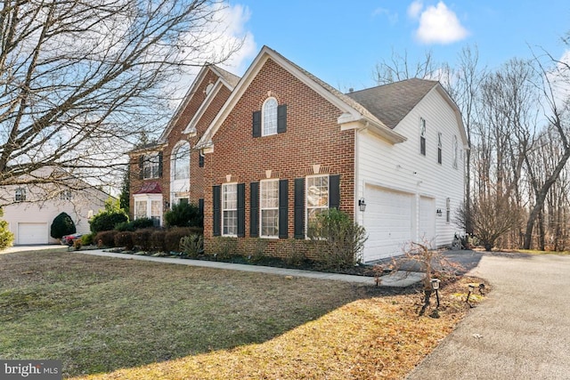 view of property exterior with a garage and a yard