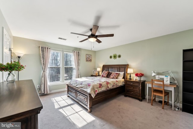 bedroom featuring light carpet and ceiling fan