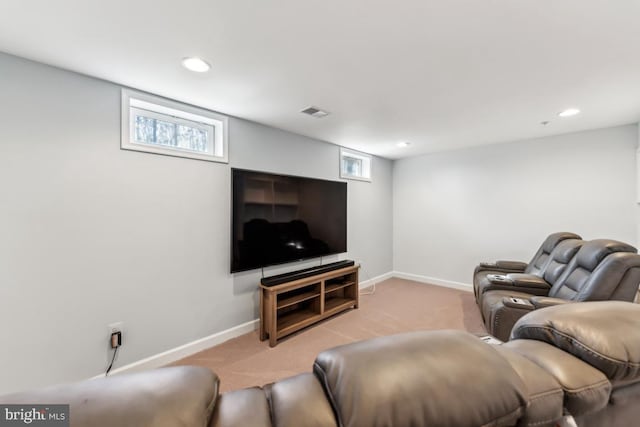 living room with light colored carpet and a healthy amount of sunlight