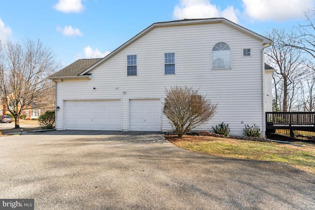 view of property exterior featuring a garage