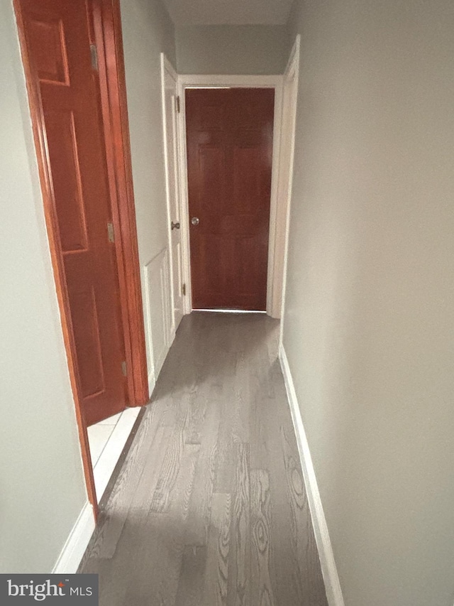 corridor with light hardwood / wood-style flooring