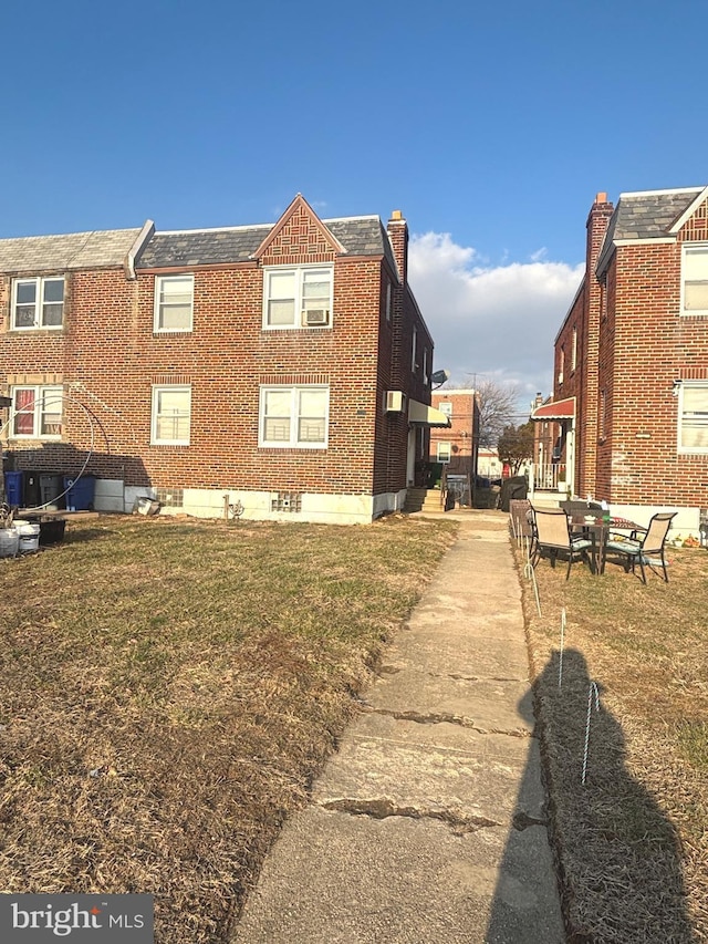 view of home's exterior featuring a yard