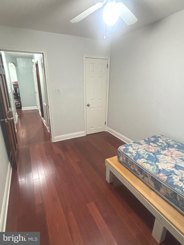 bedroom featuring ceiling fan and dark hardwood / wood-style floors