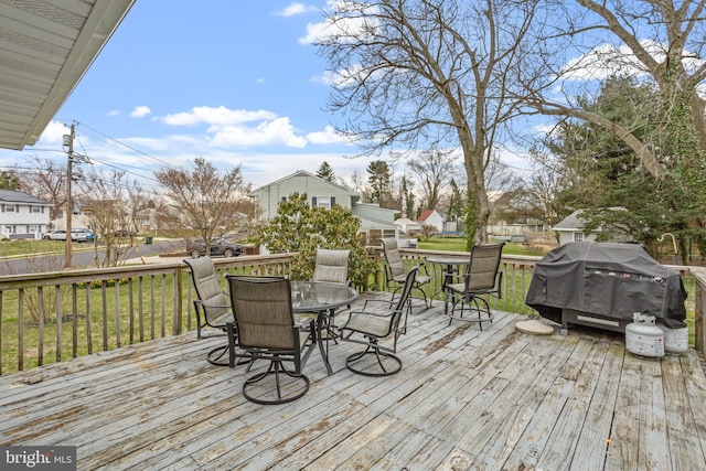 wooden deck with grilling area