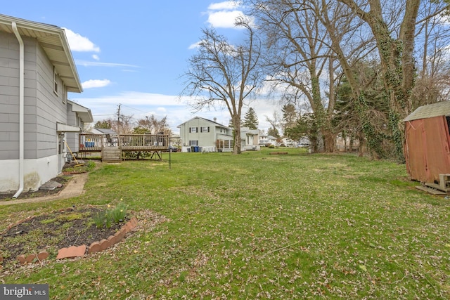 view of yard featuring a wooden deck