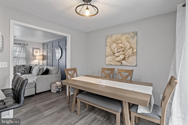 dining space featuring wood-type flooring