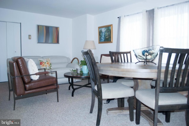 view of carpeted dining area