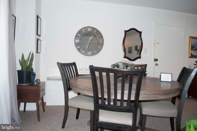 view of carpeted dining area