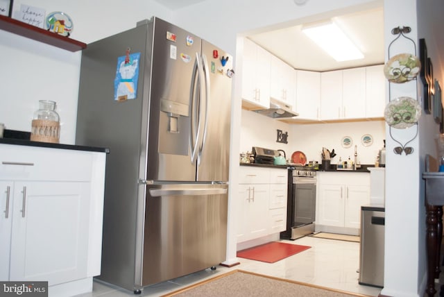 kitchen with appliances with stainless steel finishes and white cabinets