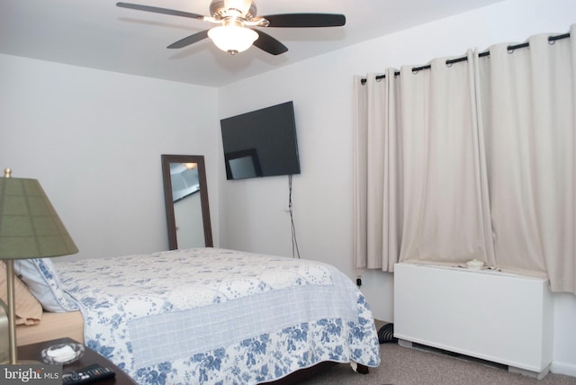 bedroom with ceiling fan and carpet