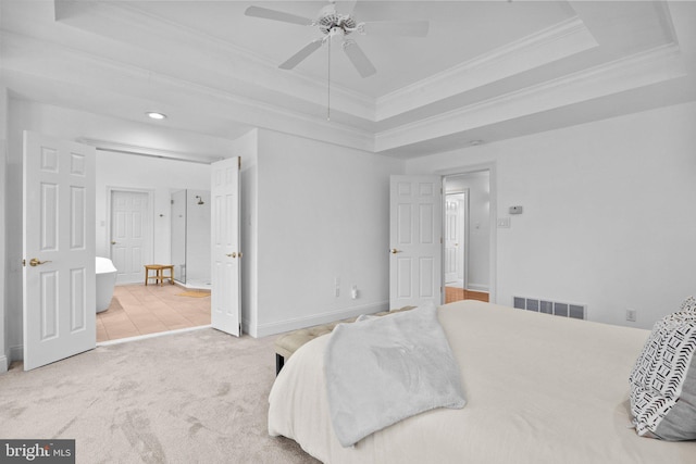 bedroom with ceiling fan, ornamental molding, carpet flooring, and a raised ceiling