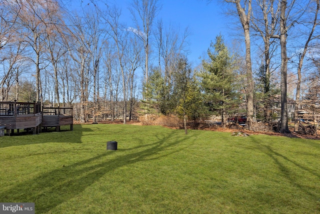 view of yard with a wooden deck