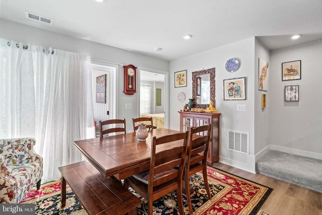 dining area featuring hardwood / wood-style flooring