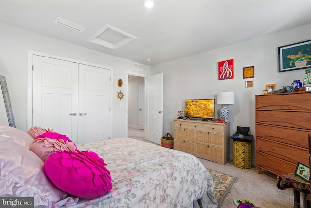 carpeted bedroom featuring a closet