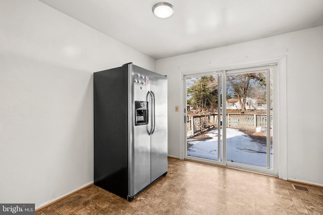 kitchen with stainless steel fridge with ice dispenser