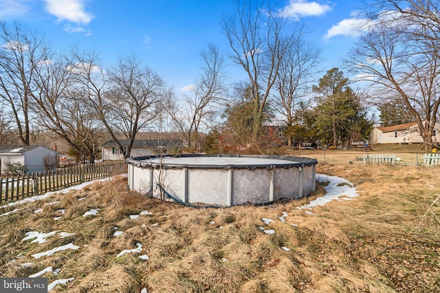 view of yard featuring a covered pool