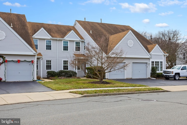 view of front of house featuring a garage and a front yard