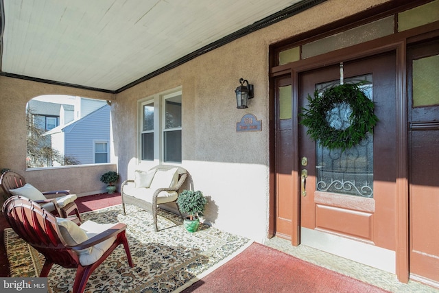 doorway to property with covered porch