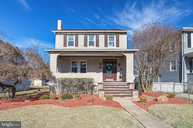 view of front property with a front yard and covered porch