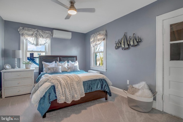 bedroom with an AC wall unit, carpet floors, and ceiling fan