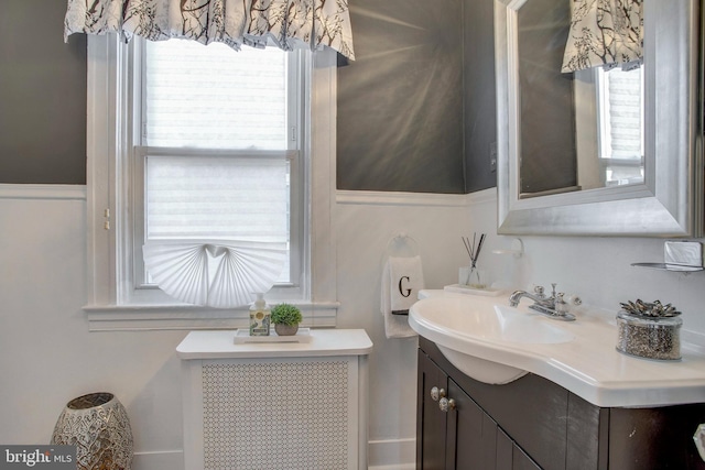 bathroom featuring vanity and radiator