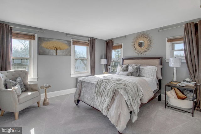 bedroom featuring light colored carpet