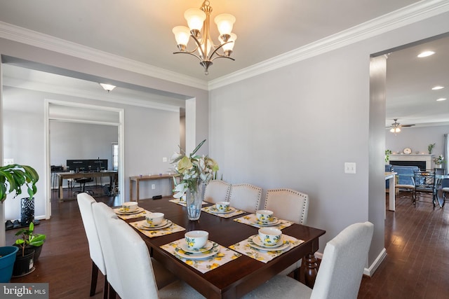dining space featuring a fireplace, baseboards, wood-type flooring, ornamental molding, and recessed lighting